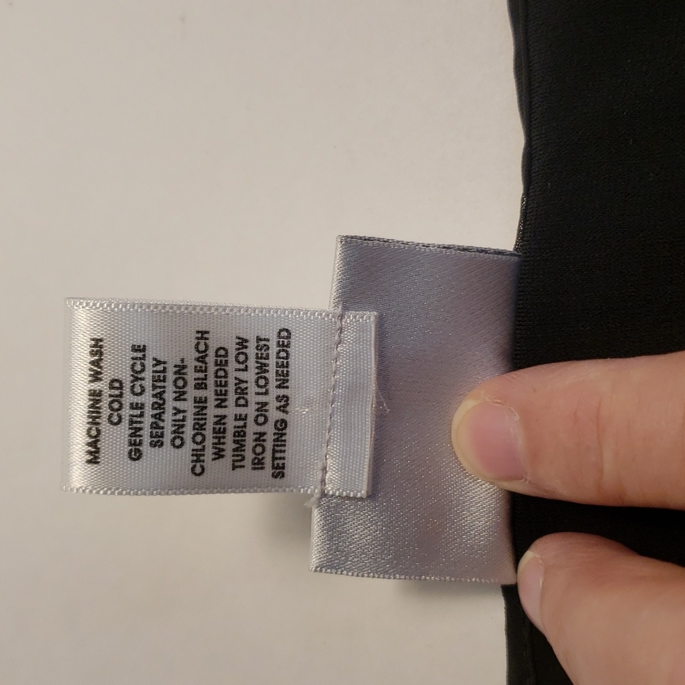 Chico's size 0 black take top.       B54 - Picture 6 of 8